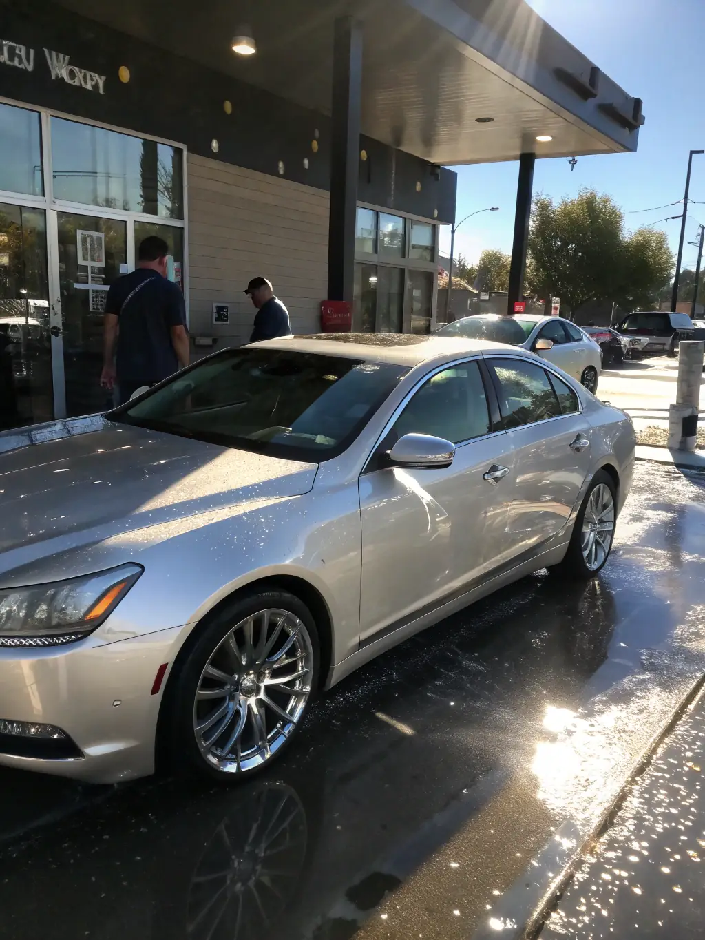 A clean and shiny car exiting the COLOSSUM PARKING car wash facility, showcasing the thoroughness and quality of the car wash service.